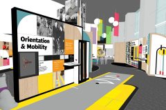 Facing northeast, a straight, light grey path with yellow trim travels from left to right at a diagonal across the image. Towards the end of the path, there is a thin white zig-zag line. To the left of the path, the back of a service dog life cast figure sits to the left of a free-standing wall with a 4x5 grid of square panels covering the surface of the wall which is trimmed in black. The dog has a guide dog harness around its chest and back and a handle that extends up at a 45-degree angle from the harness. The free-standing wall has square panels that are wood, solid colors, and wood with white quarter-circles, interspersed between photo panels and interpretive graphic panels. From left to right, the wall features black dimensional type on white that reads “Orientation & Mobility.” Below is an inset case with Buddy the dog’s harness. To the right is a white panel with black type and a corresponding braille panel. To the right of that are two orange panels with white type. Above that is a black and white portrait panel of a man holding a white cane and a second, taller panel featuring a historic photograph of Morris Frank and Dorothy Harrison Eustis standing with Buddy the dog. A large case with a collection of white canes fills the right side of the wall, some of which are behind glass, while some are available to touch, and still others are available to pick up and use on the path in the space. Behind the free-standing wall, to the left of image, is the “We Are Many Things” entry wall of square wooden panels in a similar grid design. In the distance at right, APH brand color banners and globe lighting hang from the tall ceiling.