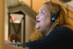 Up close of person with headphones on.